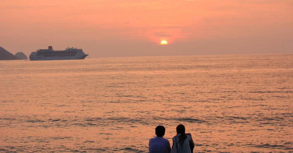 Couple enjoying sunset cruise near El Arco in Cabo San Lucas