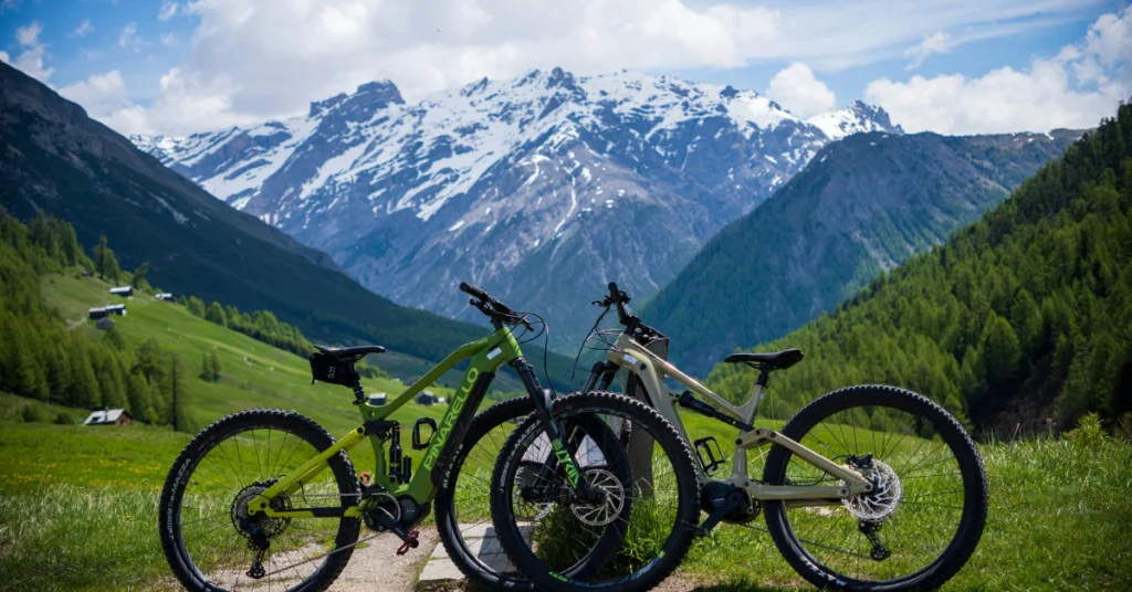 Mountain bikes on scenic trail with mountain backdrop
