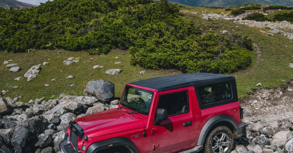 Pink off-road jeep parked on a rocky trail in Sedona backcountry