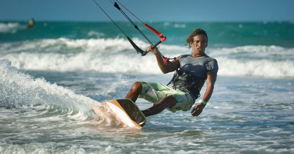 Kitesurfer riding the waves on a windy day in the Caribbean sea