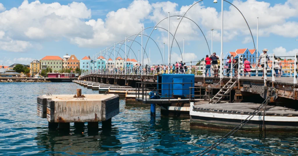 Queen Emma Bridge and the colorful waterfront buildings in Willemstad