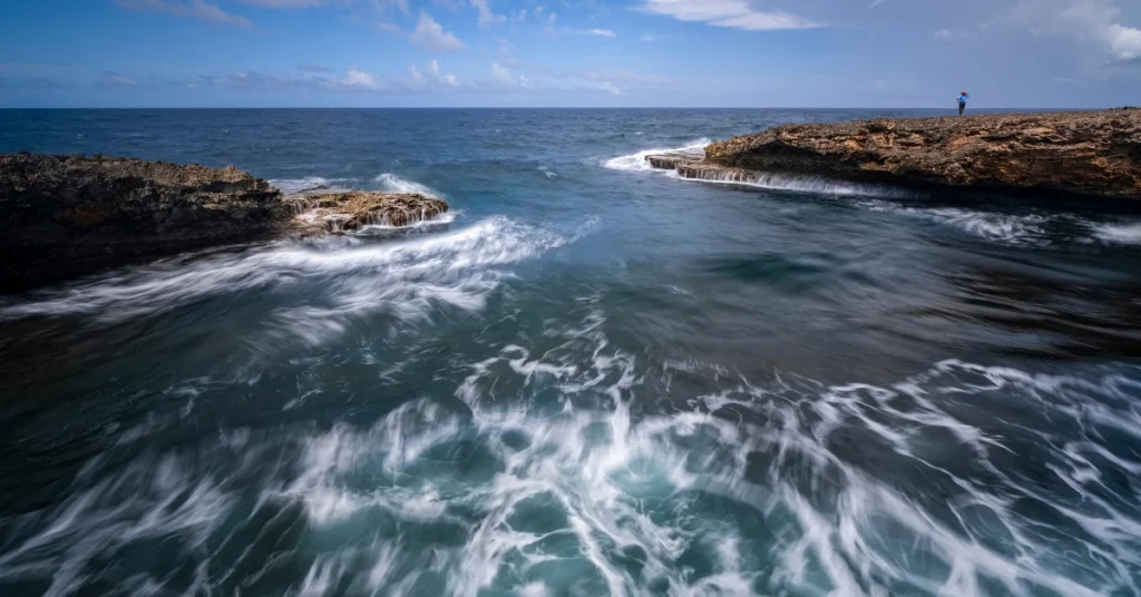 Waves washing over the rocky coastline of Curaçao