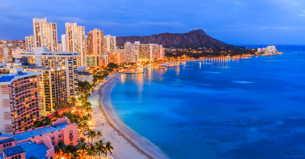 Aerial view of Waikiki Beach with Honolulu high-rise hotels and Diamond Head along the turquoise coastline