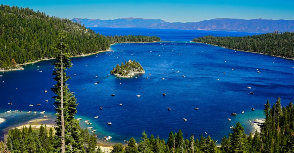 Emerald Bay in Lake Tahoe with a small island, deep blue water and pine trees