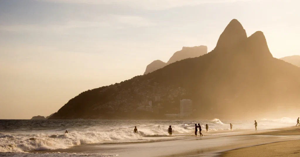 Ipanema Beach at golden hour with the Two Brothers mountain in the background