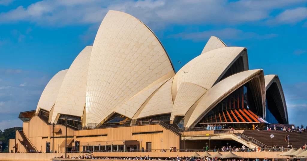 Close-up of the Sydney Opera House white sails under a blue sky